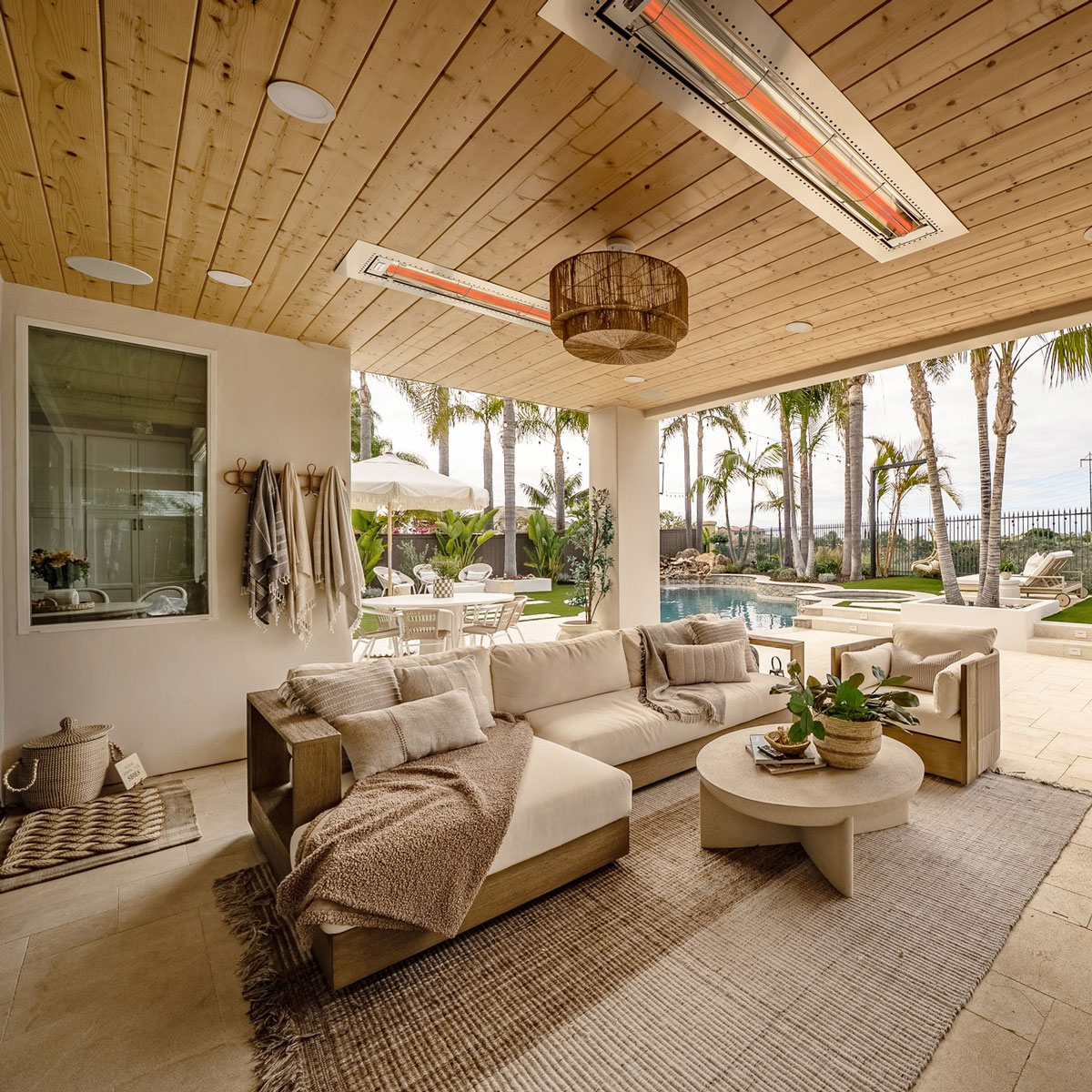 Flush fixtures installed into ceiling for poolside indoor/outdoor patio